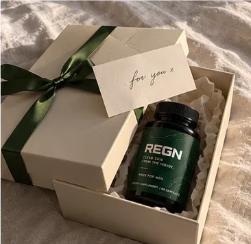 REGN bottle in a gift box with a green ribbon and a note reading 'for you'